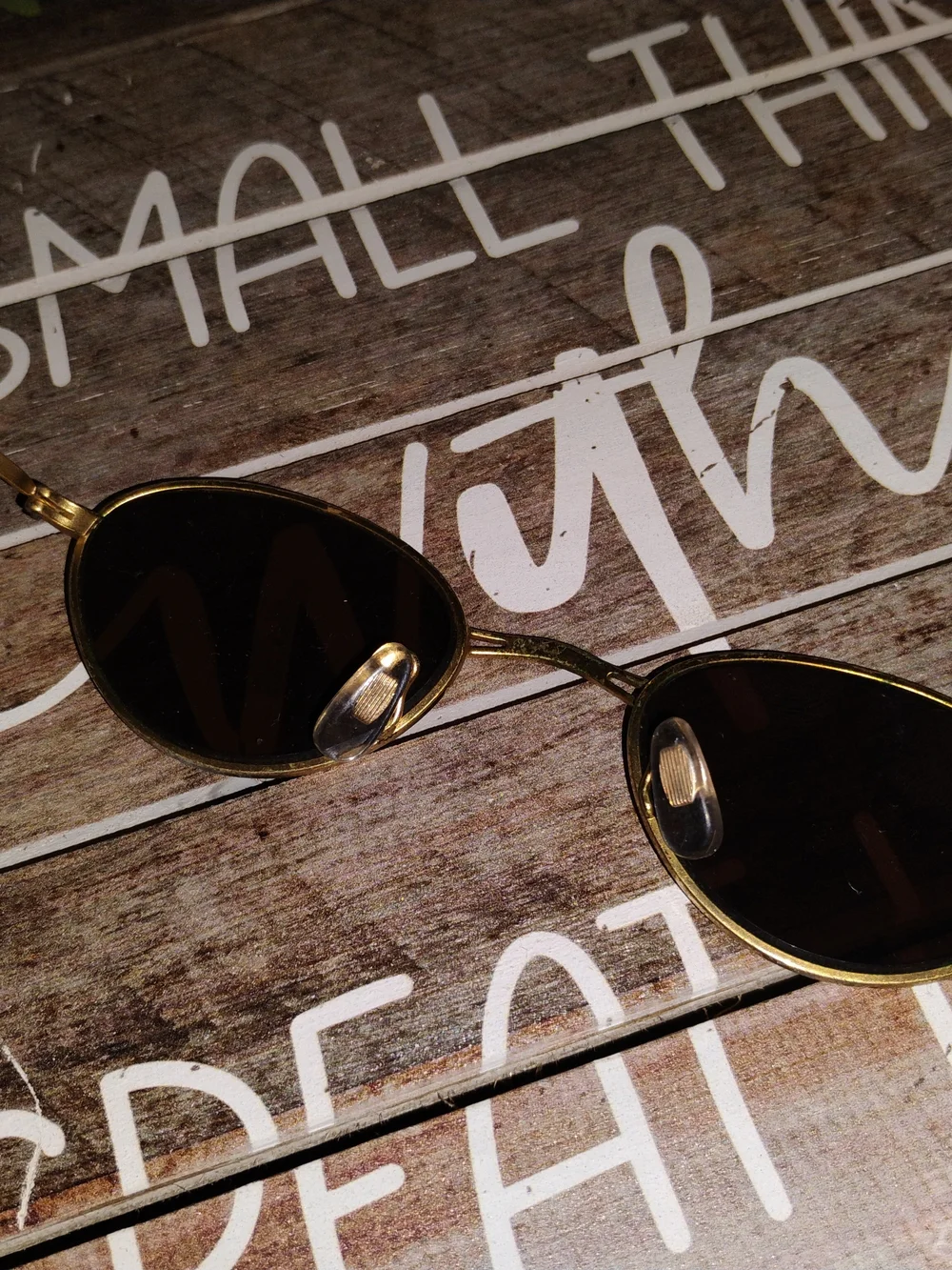 Ray-Ban Gold Oval Sunglasses with Dark Lenses